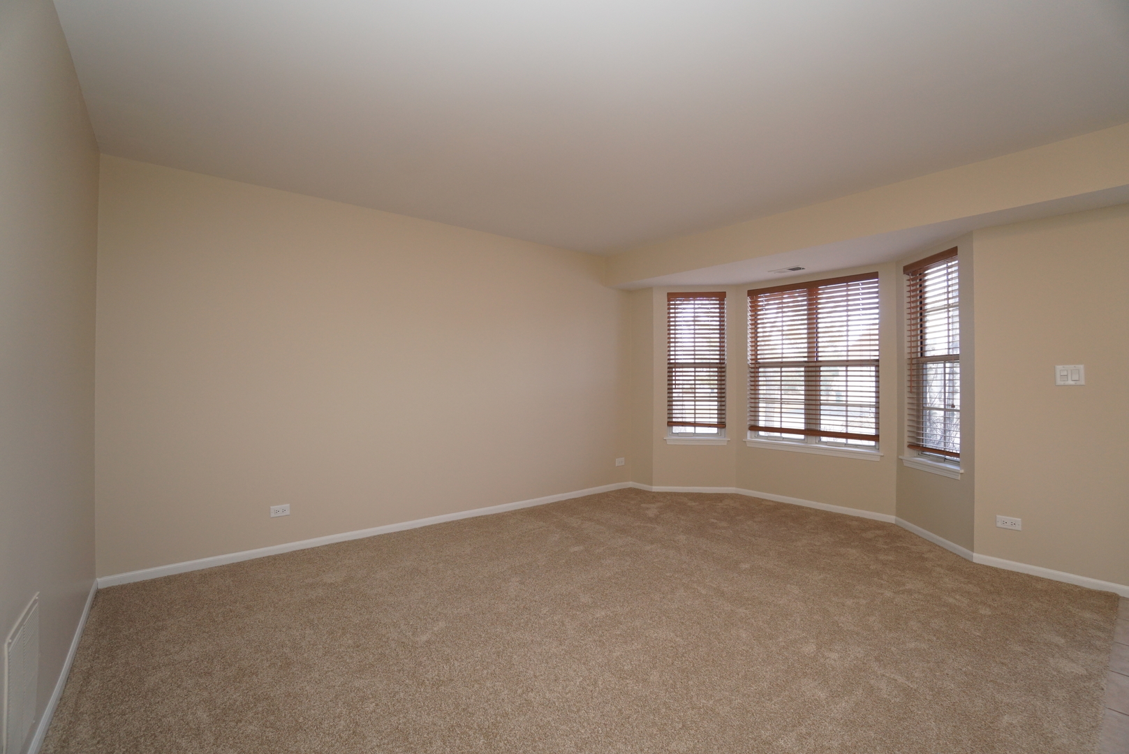 86 Bradford Lane Mundelein, IL 60060 - Photo 3 of 21 a view of an empty room with a window