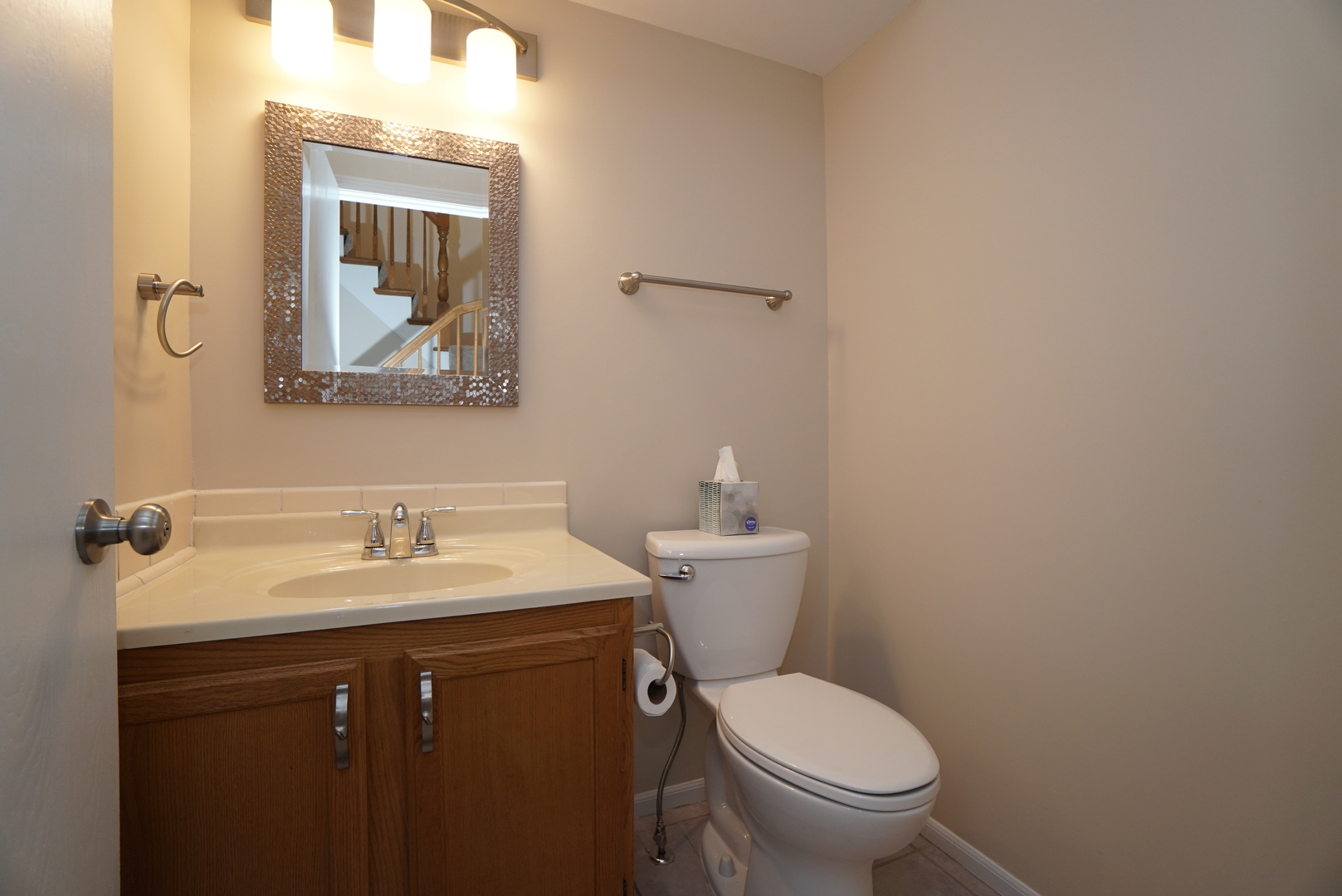 86 Bradford Lane Mundelein, IL 60060 - Photo 8 of 21 a bathroom with a toilet sink and mirror