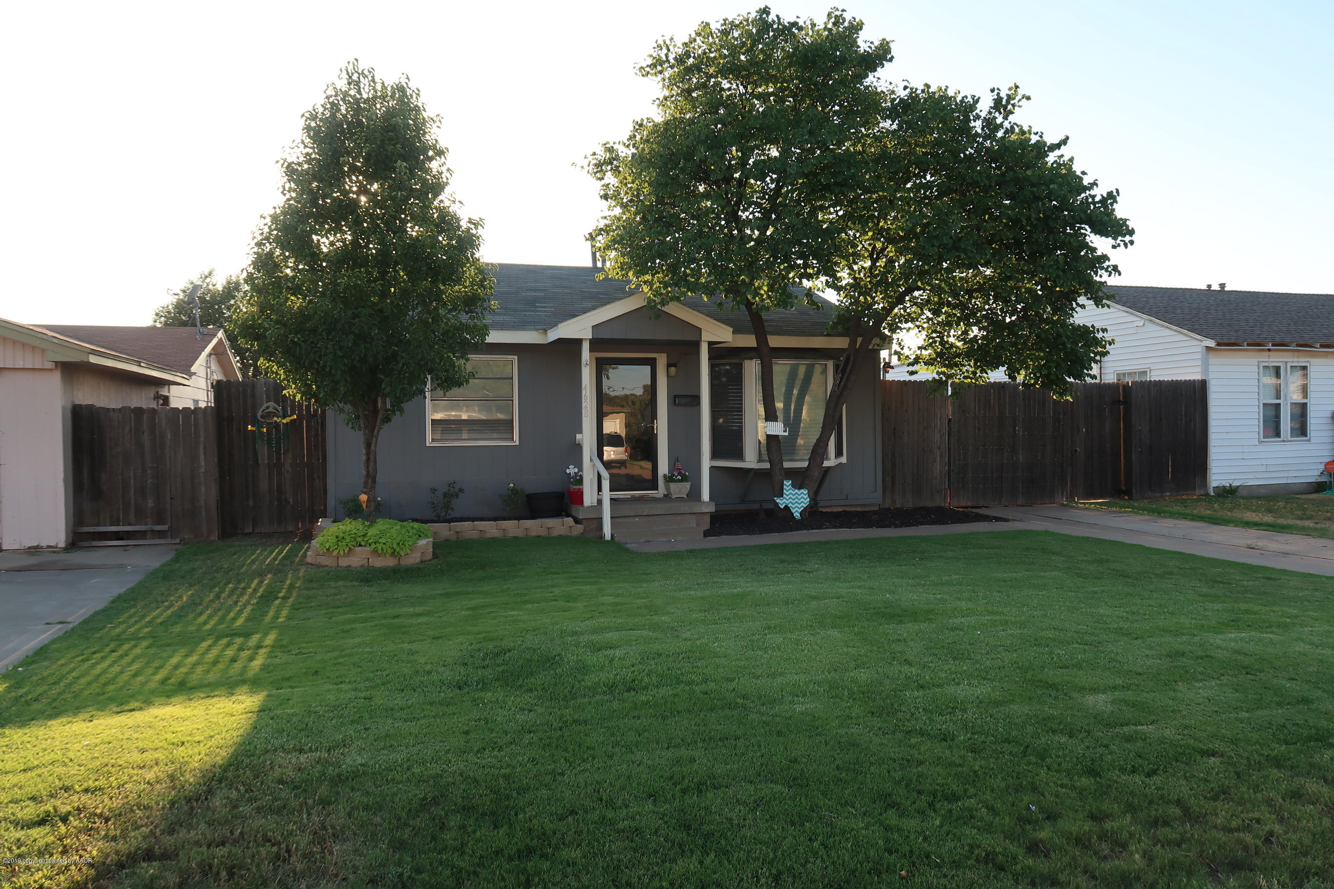 4628 South Bonham Street Amarillo, TX 79110 - Photo 1 of 22 front view of a house with a yard