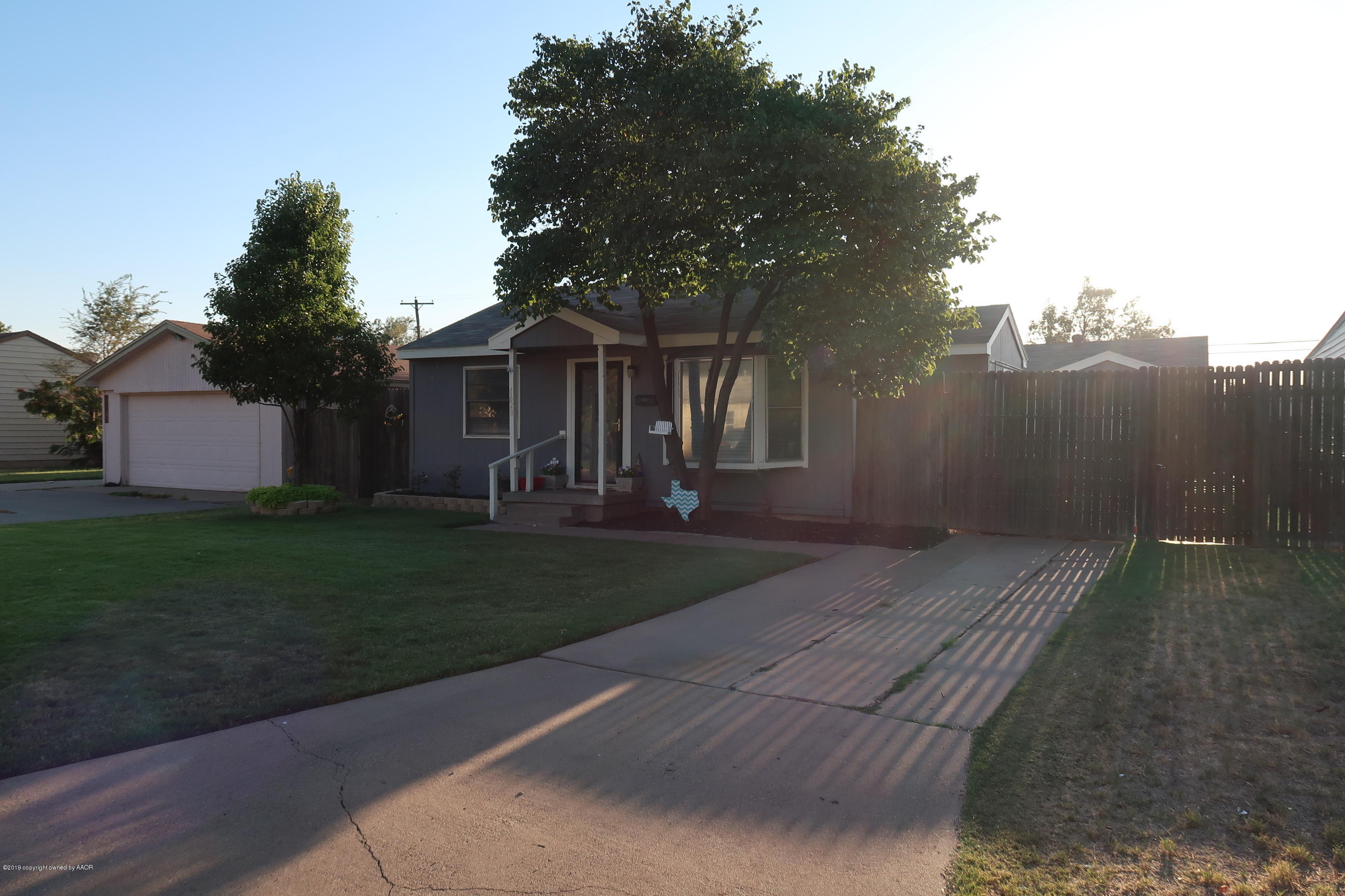 4628 South Bonham Street Amarillo, TX 79110 - Photo 3 of 22 a front view of a house with garden