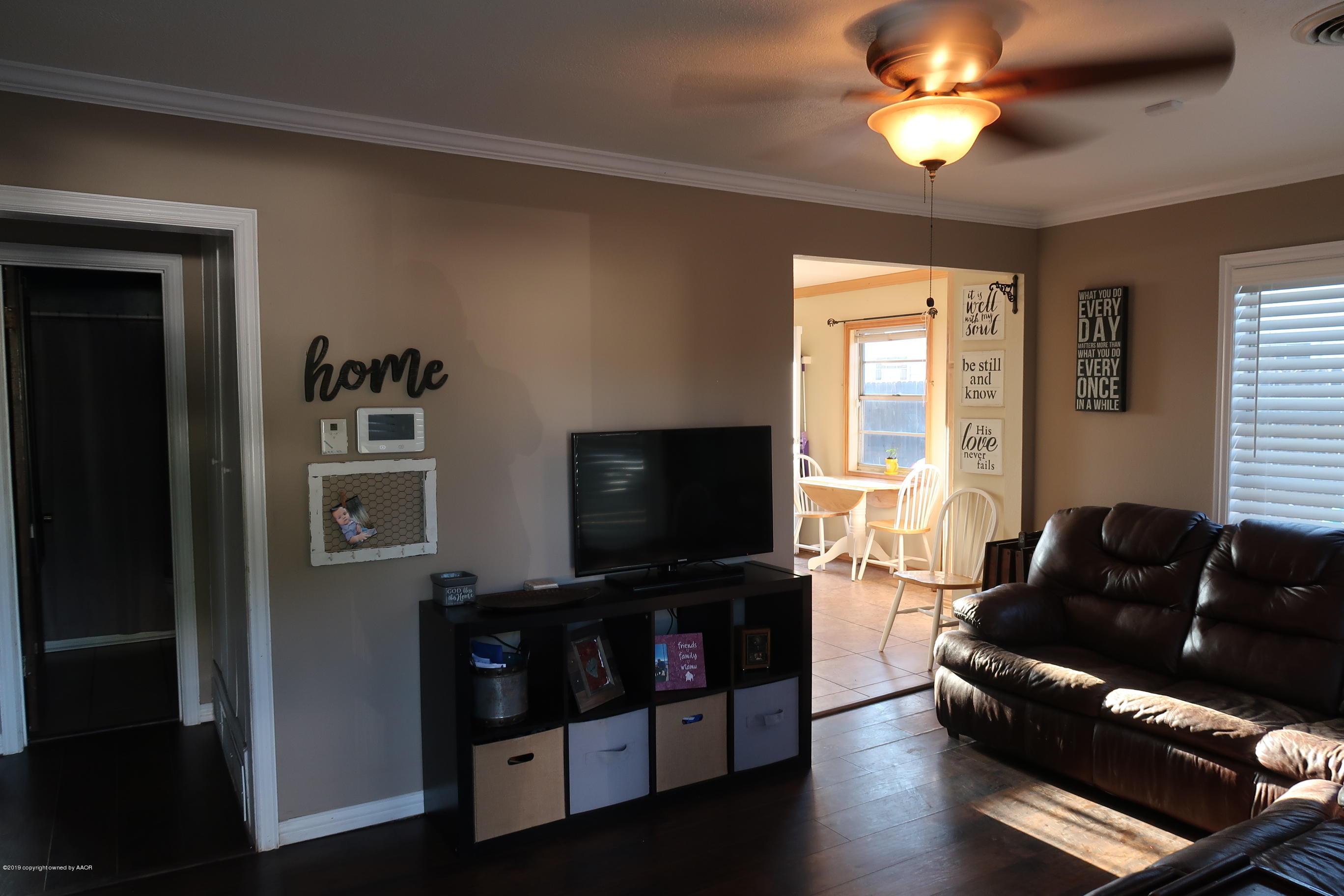 4628 South Bonham Street Amarillo, TX 79110 - Photo 4 of 22 a living room with furniture and a flat screen tv