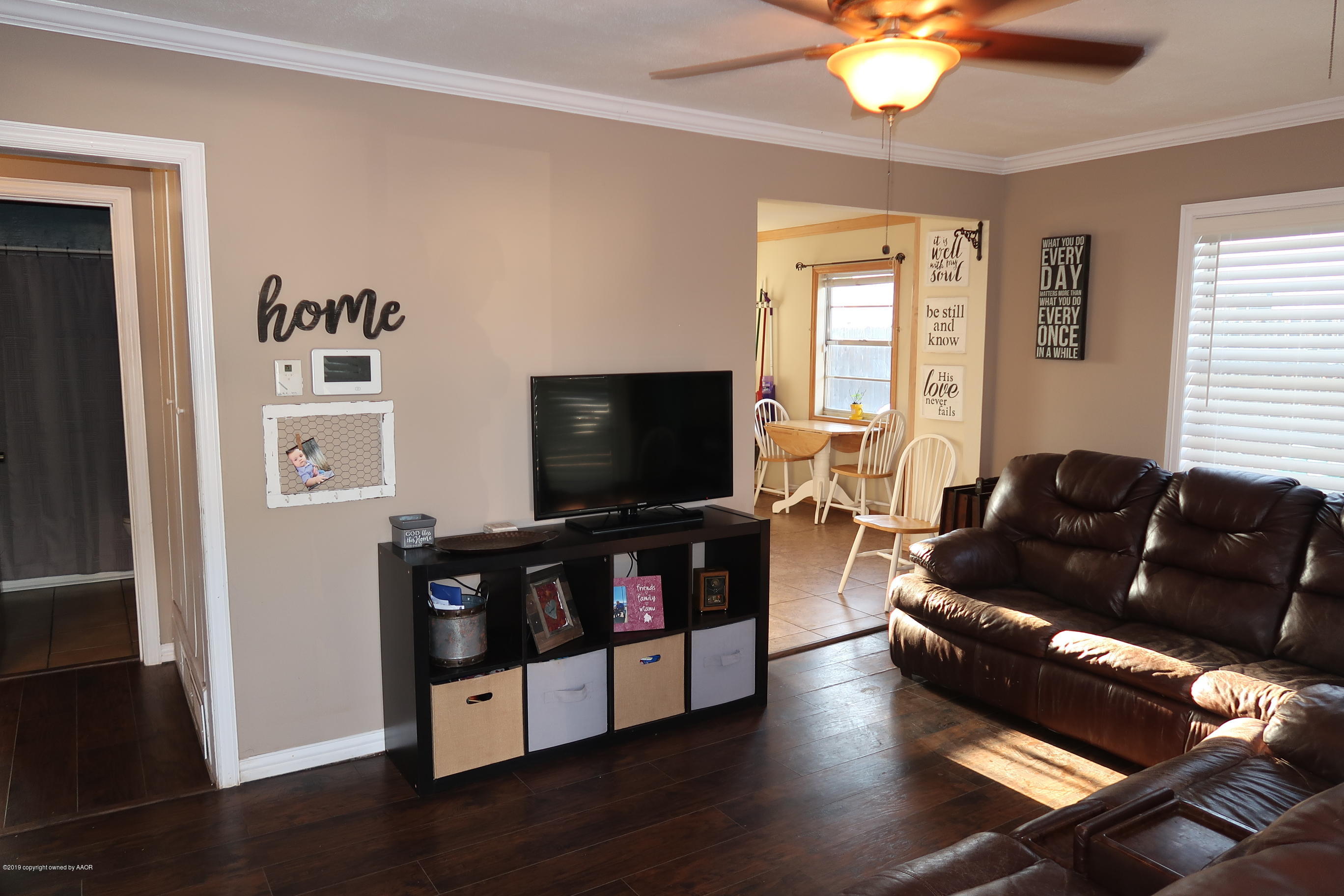 4628 South Bonham Street Amarillo, TX 79110 - Photo 5 of 22 a living room with furniture and a flat screen tv