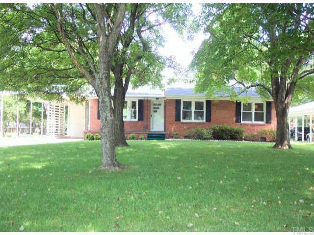 3401 Old Buffaloe Road Raleigh, NC 27604 - Photo 1 of 1 a front view of house with yard and green space