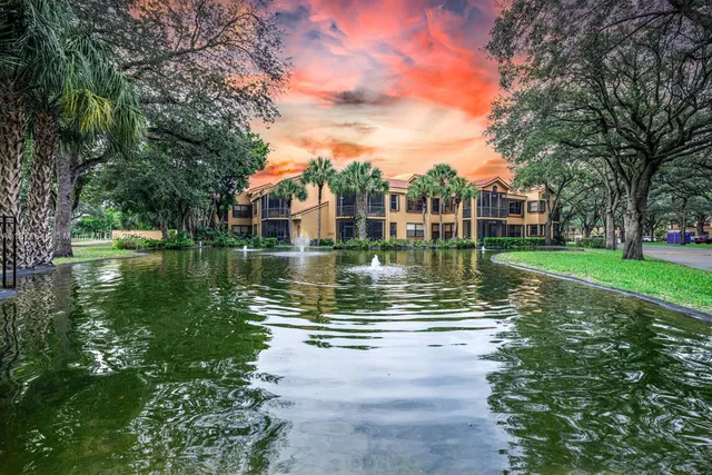 a view of a lake with a house in the background