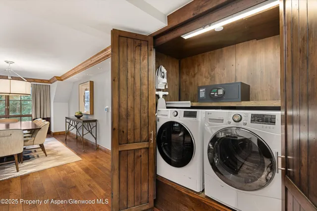 a view of a hallway with washer and dryer