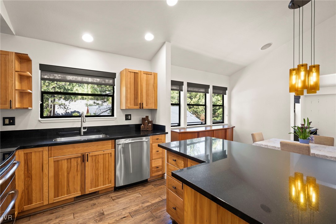 759 Judith Court Incline Village, NV 89451 - Photo 12 of 36 a kitchen with stainless steel appliances granite countertop sink stove and wooden cabinets
