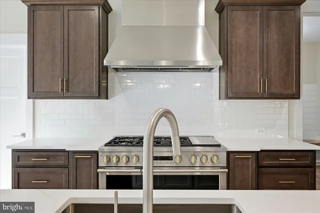 a kitchen with a stove and a microwave