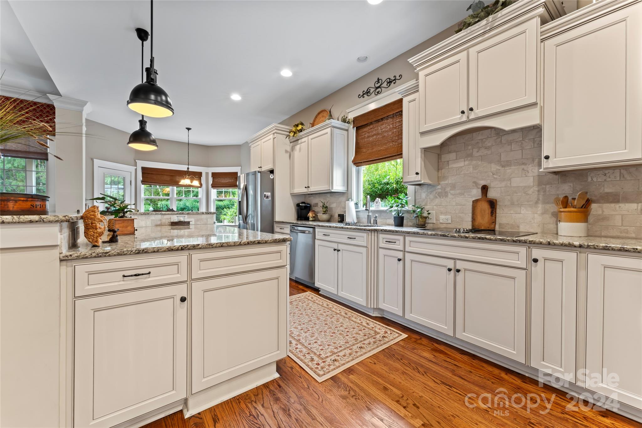 6059 Daphne Circle Fort Mill, SC 29708 - Photo 12 of 48 a kitchen with white cabinets and white appliances