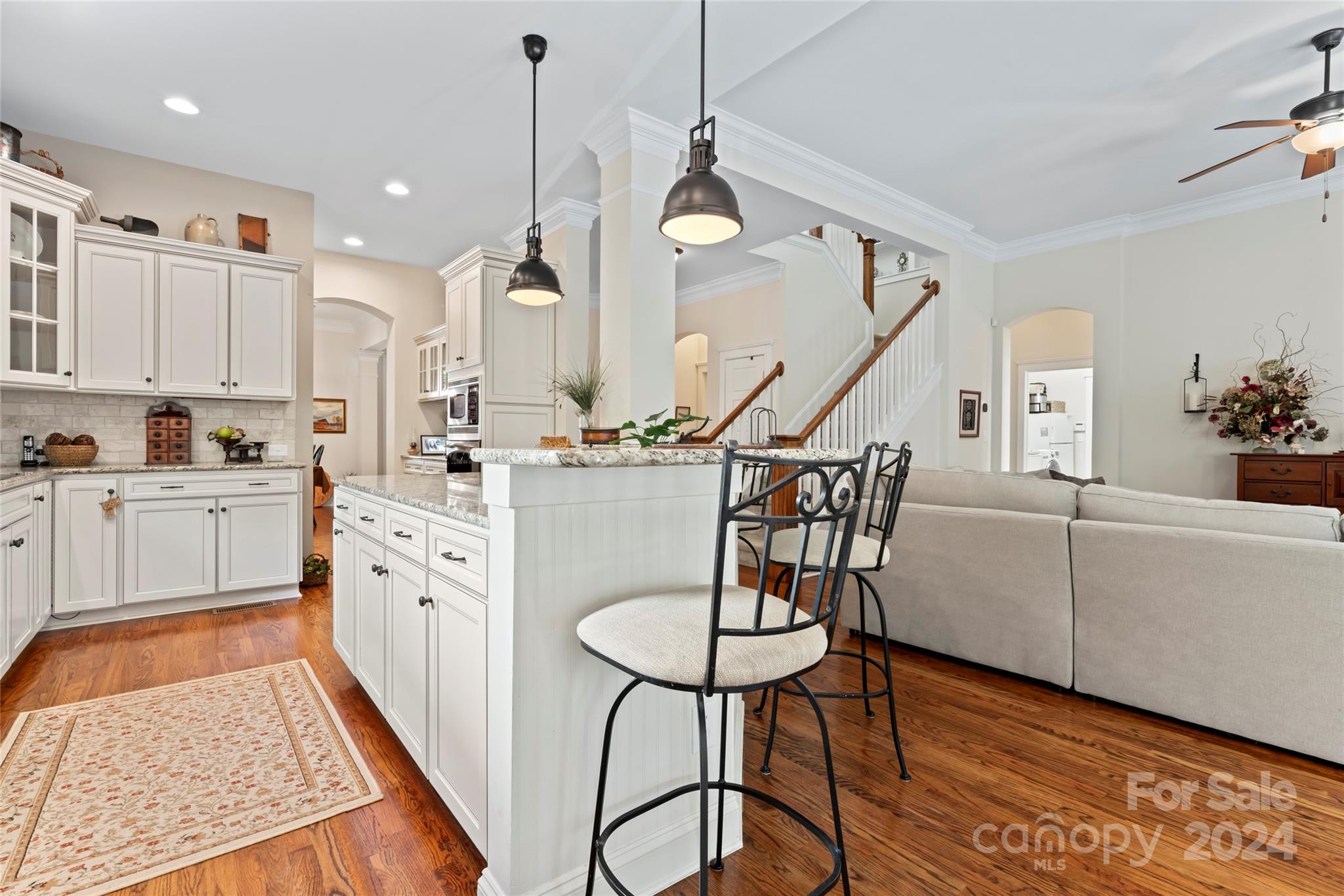 6059 Daphne Circle Fort Mill, SC 29708 - Photo 13 of 48 a kitchen with furniture a center island stainless steel appliances cabinets and a rug