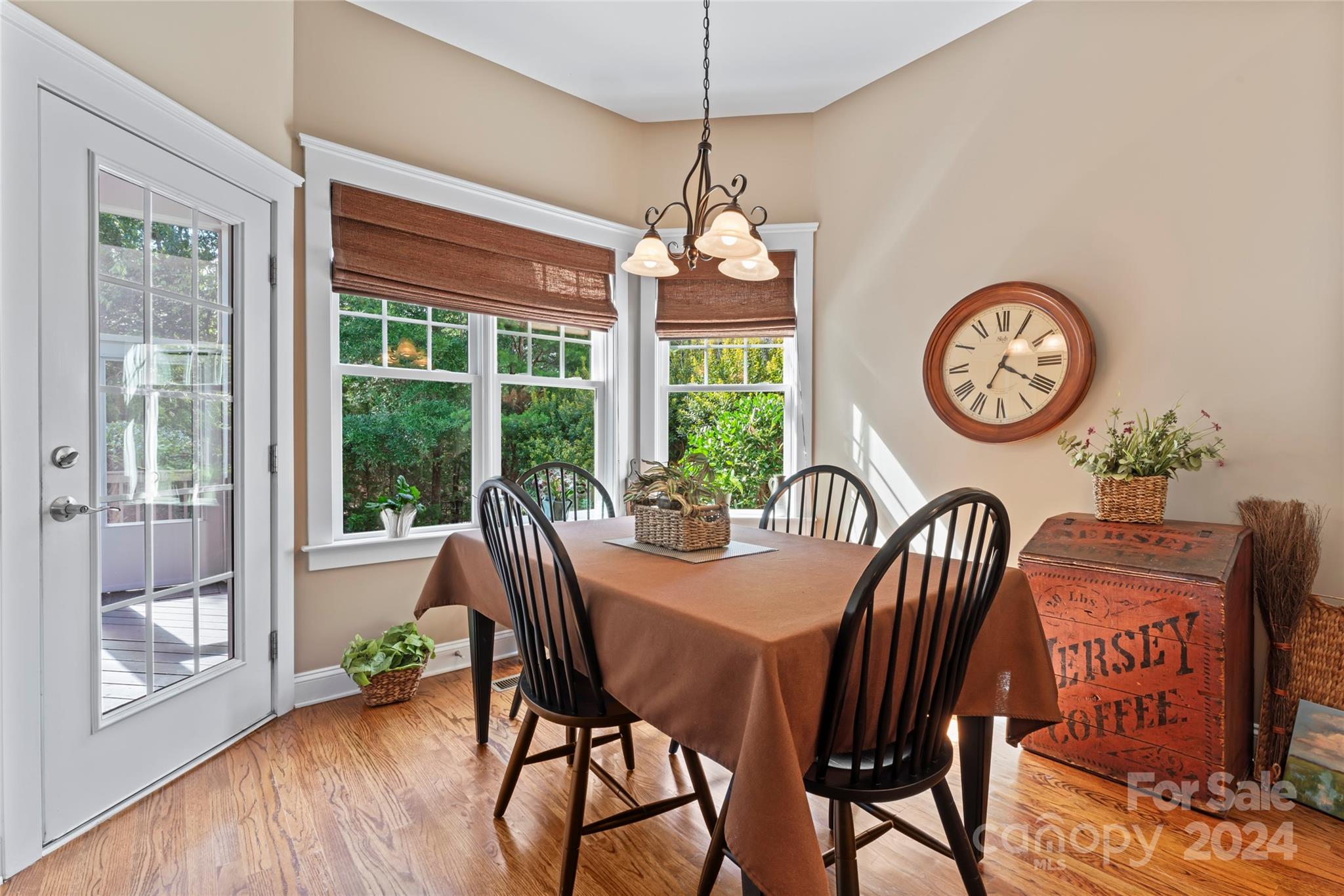 6059 Daphne Circle Fort Mill, SC 29708 - Photo 17 of 48 a view of a dining room with furniture wooden floor and a clock