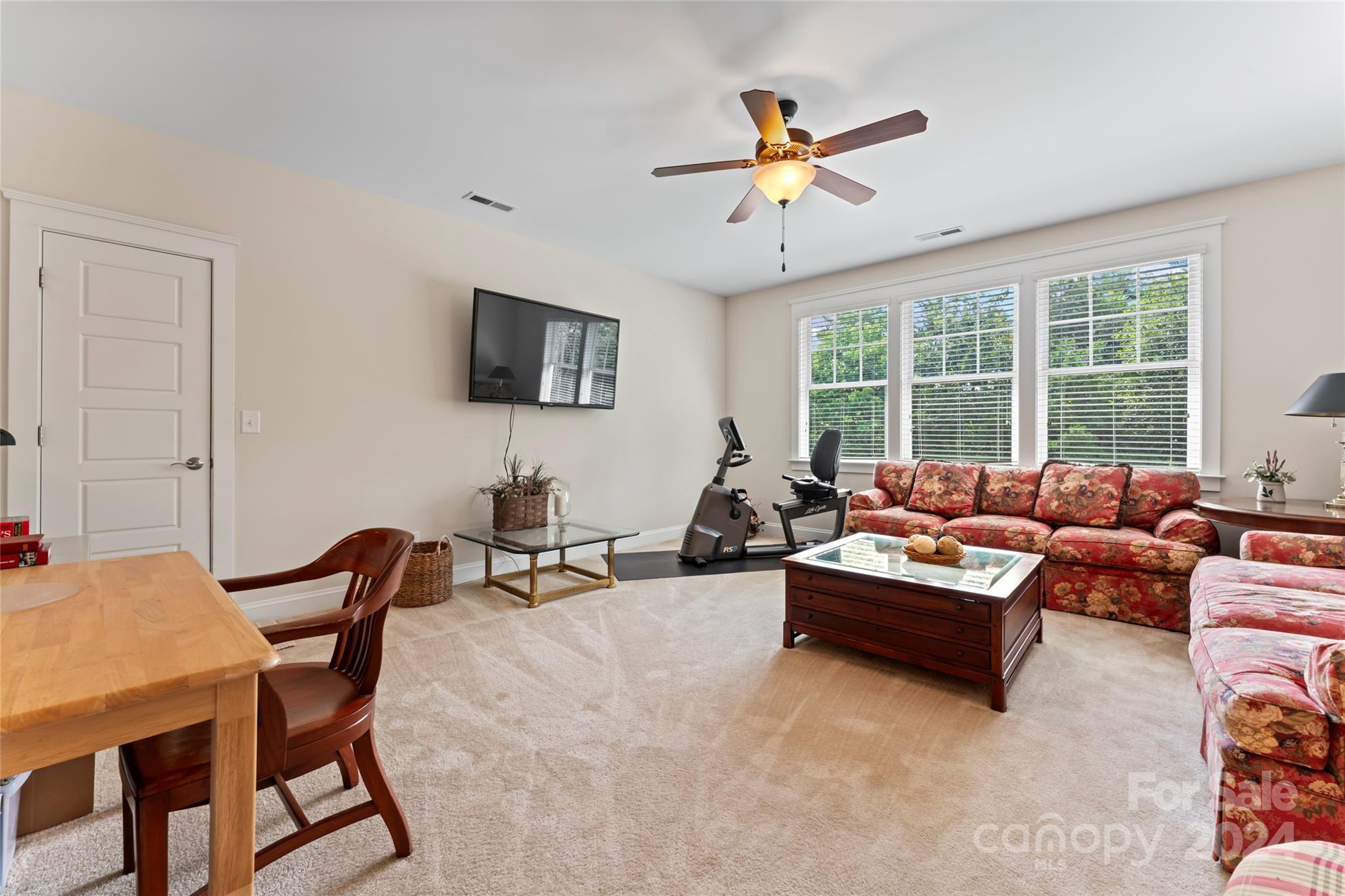 6059 Daphne Circle Fort Mill, SC 29708 - Photo 19 of 48 a living room with furniture and a flat screen tv