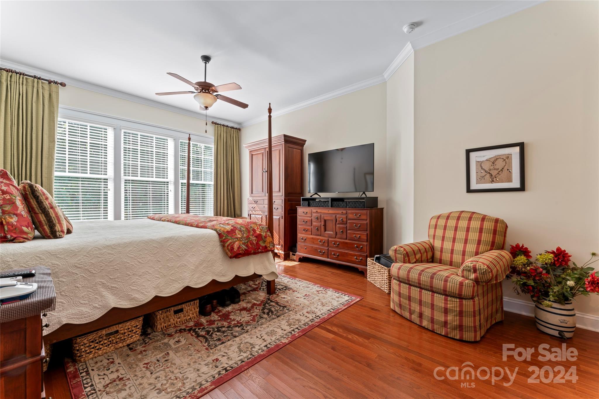 6059 Daphne Circle Fort Mill, SC 29708 - Photo 24 of 48 a bedroom with a bed couch and a flat tv screen