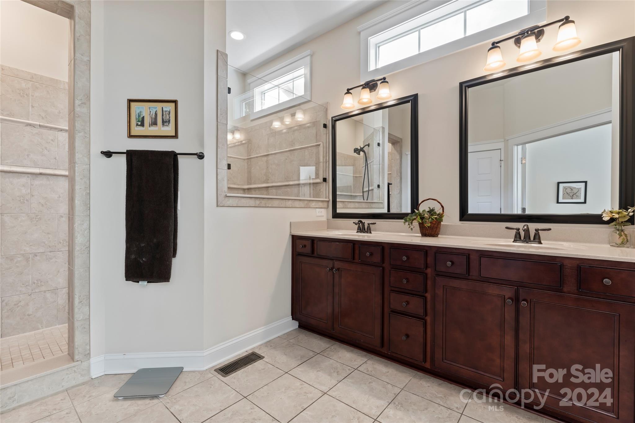 6059 Daphne Circle Fort Mill, SC 29708 - Photo 26 of 48 a bathroom with a double vanity sink and mirror