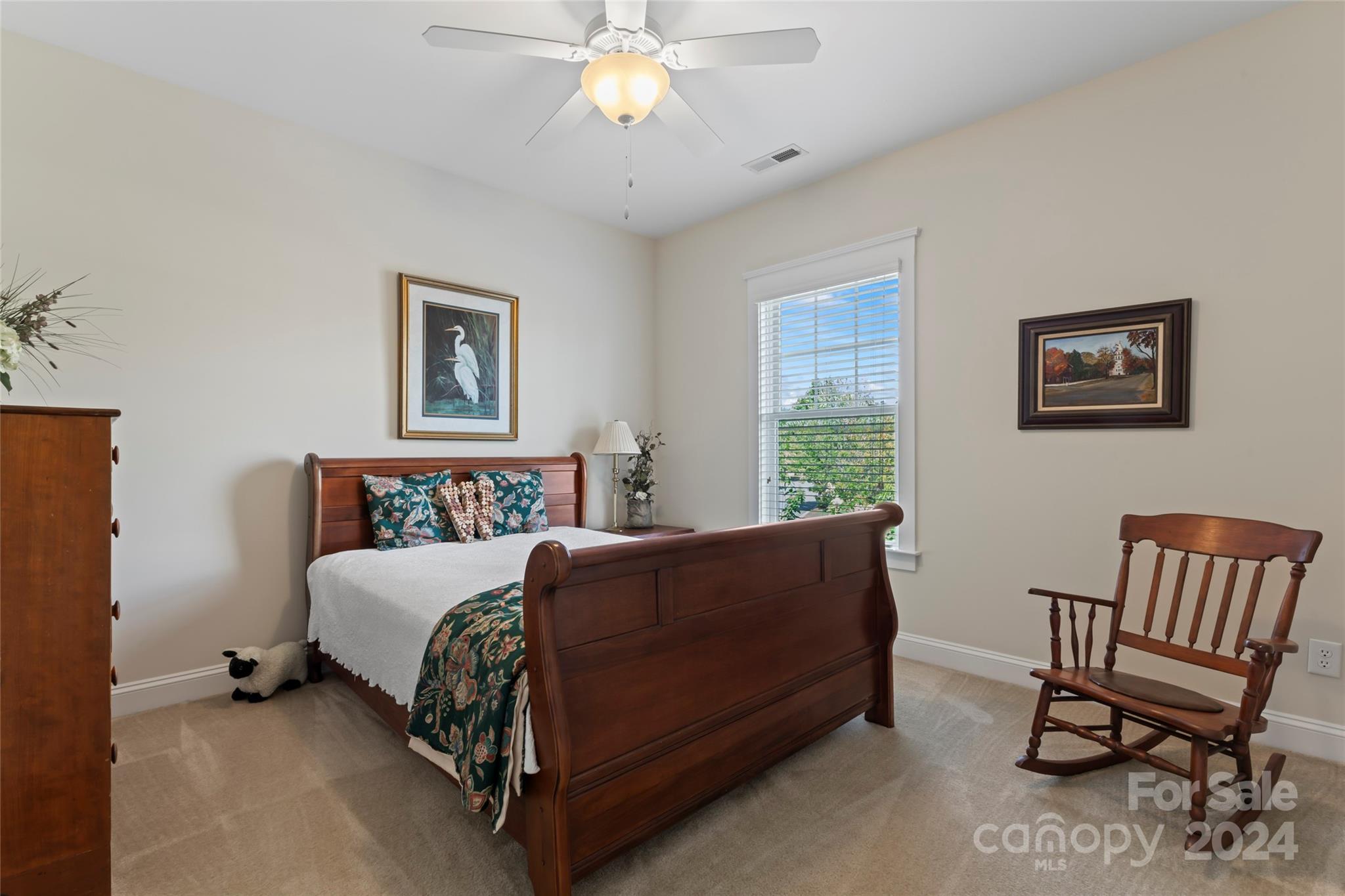 6059 Daphne Circle Fort Mill, SC 29708 - Photo 32 of 48 a bedroom with a bed and a chair