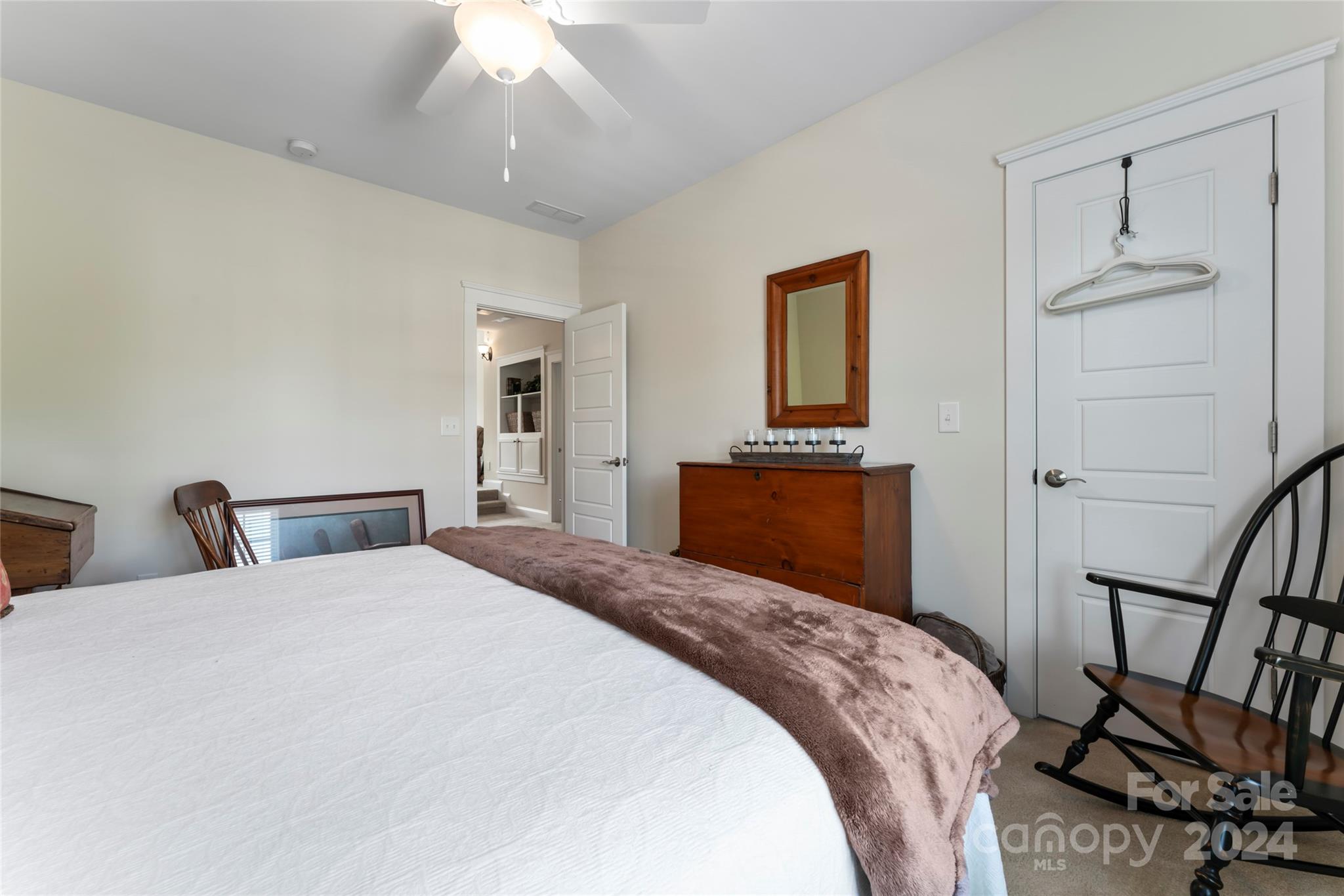 6059 Daphne Circle Fort Mill, SC 29708 - Photo 33 of 48 a bedroom with a bed and a chandelier