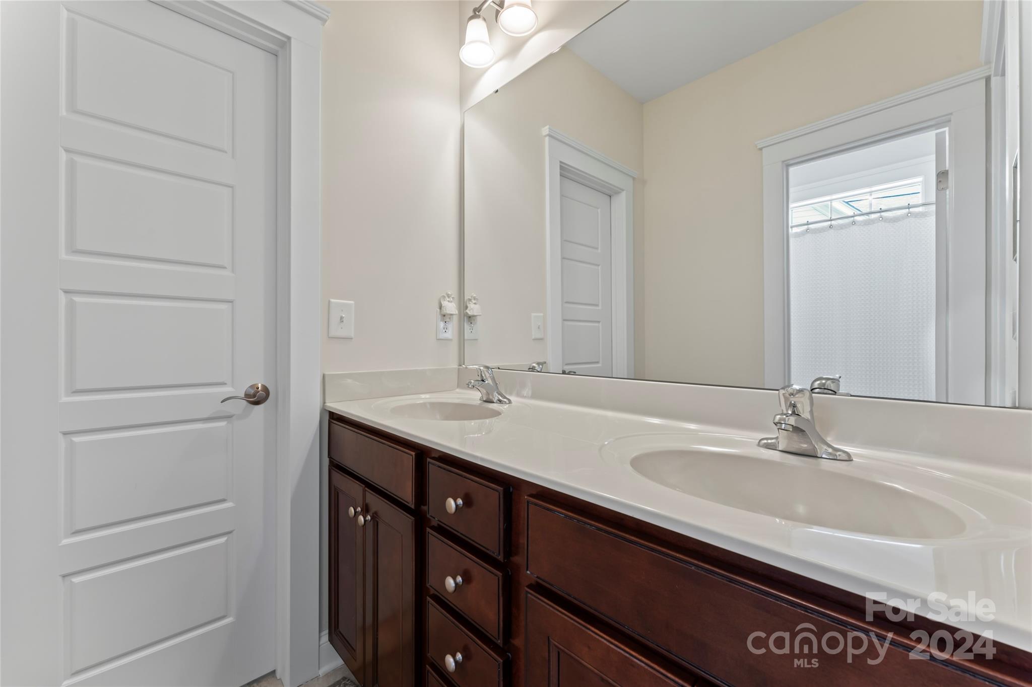 6059 Daphne Circle Fort Mill, SC 29708 - Photo 34 of 48 a bathroom with a double vanity sink and a mirror