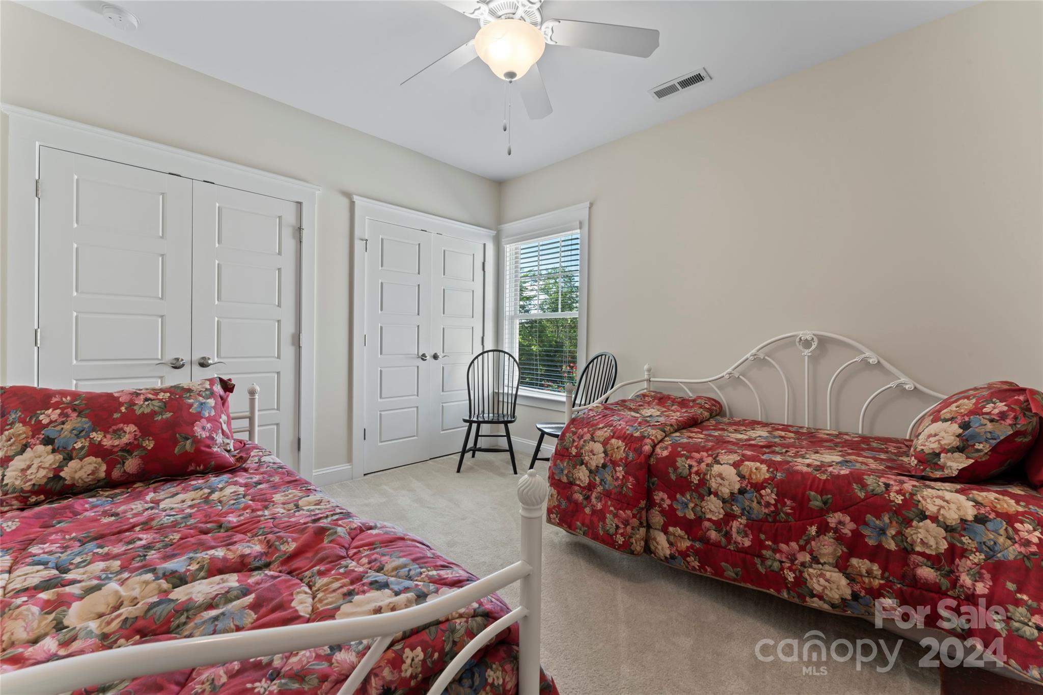 6059 Daphne Circle Fort Mill, SC 29708 - Photo 35 of 48 a bedroom with a bed and a chandelier