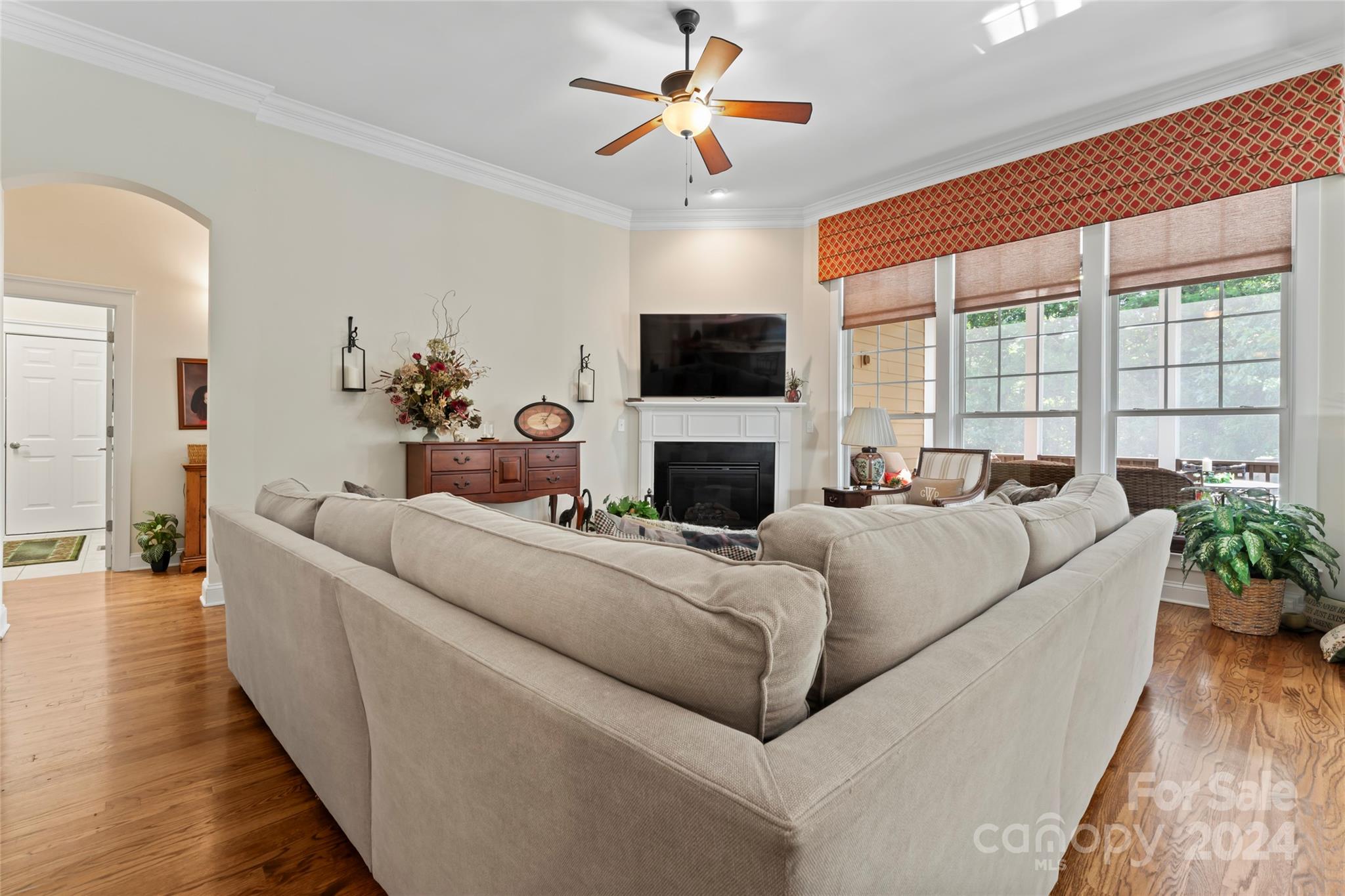 6059 Daphne Circle Fort Mill, SC 29708 - Photo 9 of 48 a living room with furniture a fireplace and a flat screen tv