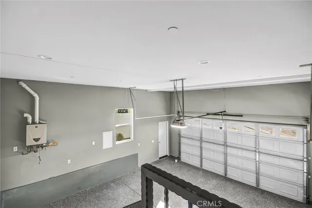 a kitchen with cabinets and window