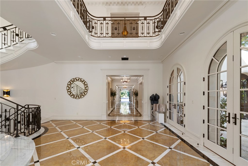 22 Deep Sea Newport Coast, CA 92657 - Photo 12 of 57 a view of a hallway with paintings on the wall