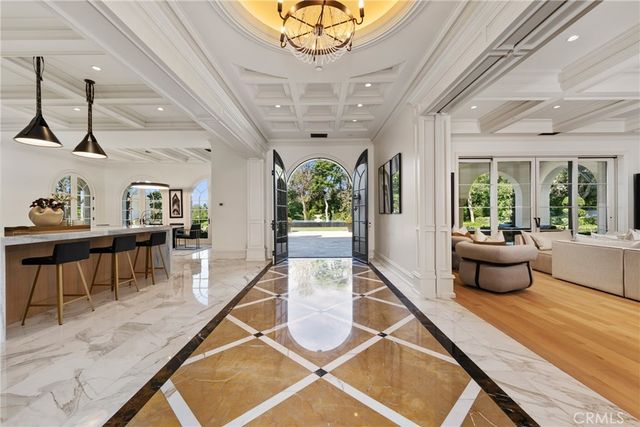 a kitchen with stainless steel appliances a stove a sink and a refrigerator