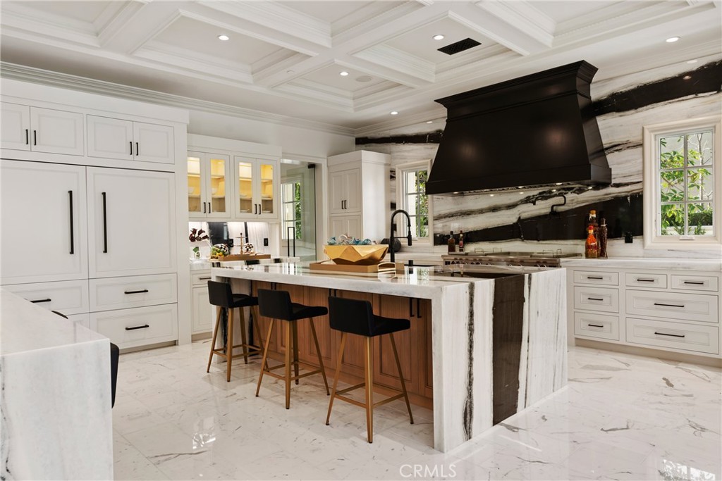 22 Deep Sea Newport Coast, CA 92657 - Photo 15 of 57 a kitchen with stainless steel appliances a stove a sink and a refrigerator