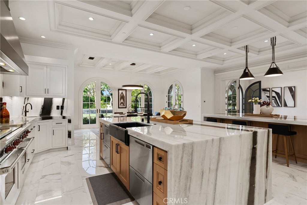 22 Deep Sea Newport Coast, CA 92657 - Photo 16 of 57 a open kitchen with stainless steel appliances granite countertop a stove and cabinets