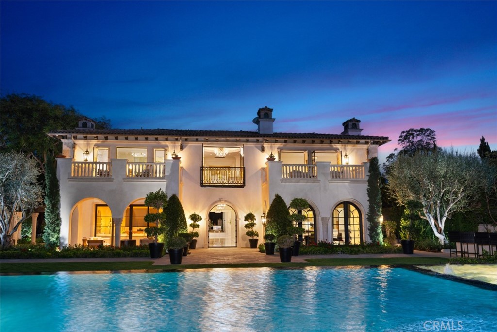 22 Deep Sea Newport Coast, CA 92657 - Photo 2 of 57 a front view of a house with garden