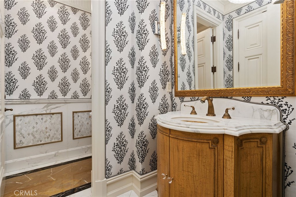 22 Deep Sea Newport Coast, CA 92657 - Photo 21 of 57 a bathroom with a granite countertop sink and a mirror