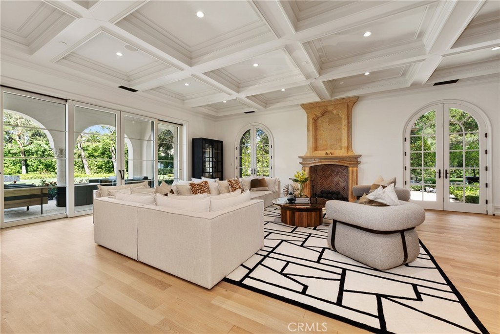 22 Deep Sea Newport Coast, CA 92657 - Photo 22 of 57 a living room with furniture a large window and a fireplace