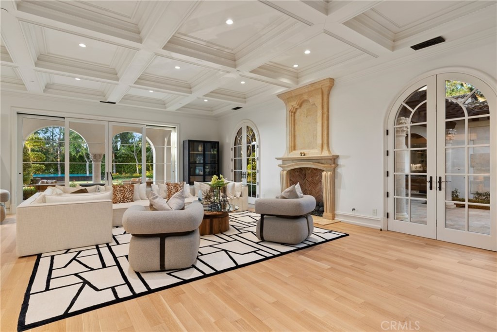 22 Deep Sea Newport Coast, CA 92657 - Photo 23 of 57 a living room with furniture and a fireplace