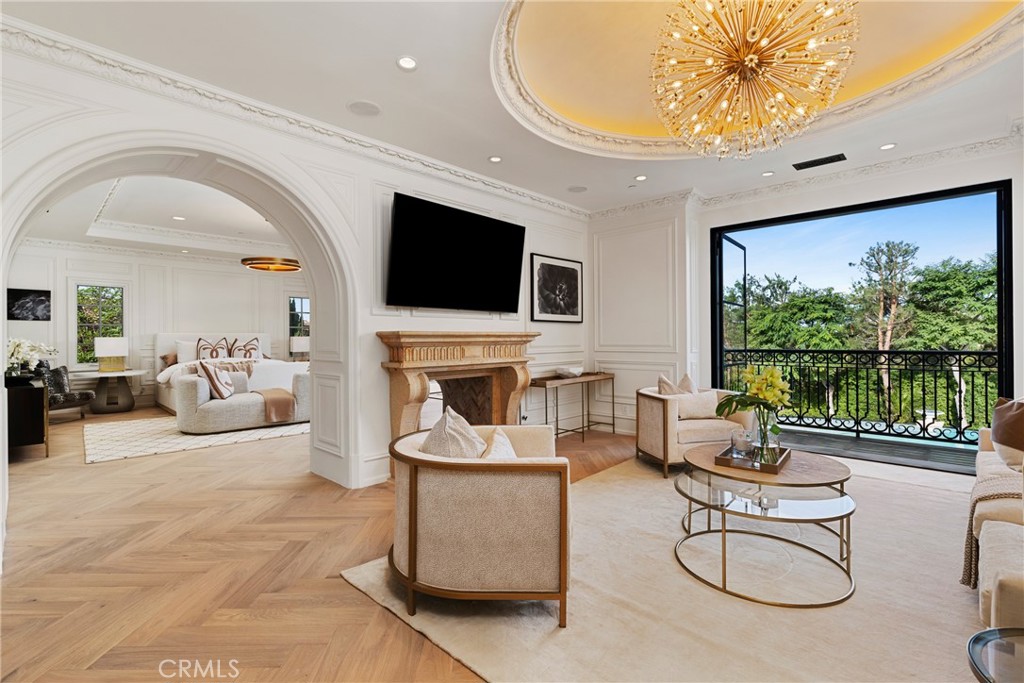 22 Deep Sea Newport Coast, CA 92657 - Photo 27 of 57 a living room with fireplace furniture and a flat screen tv