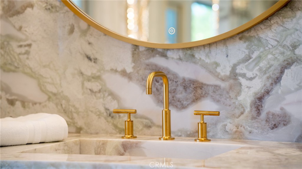 22 Deep Sea Newport Coast, CA 92657 - Photo 34 of 57 a bathroom with a sink and mirror