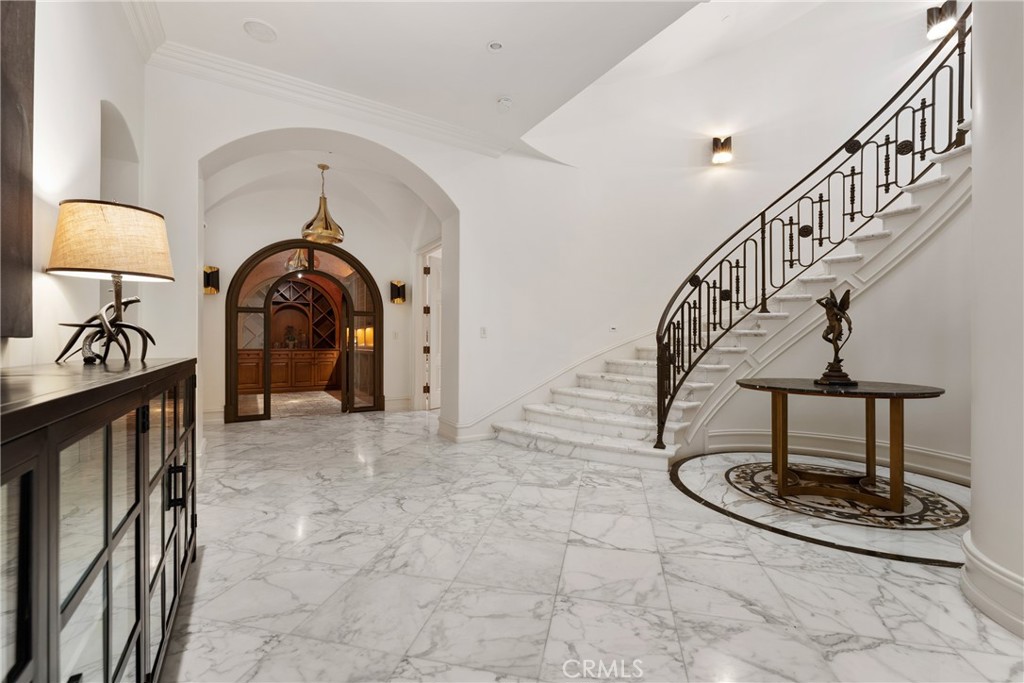 22 Deep Sea Newport Coast, CA 92657 - Photo 43 of 57 a view of staircase with a washer and dryer