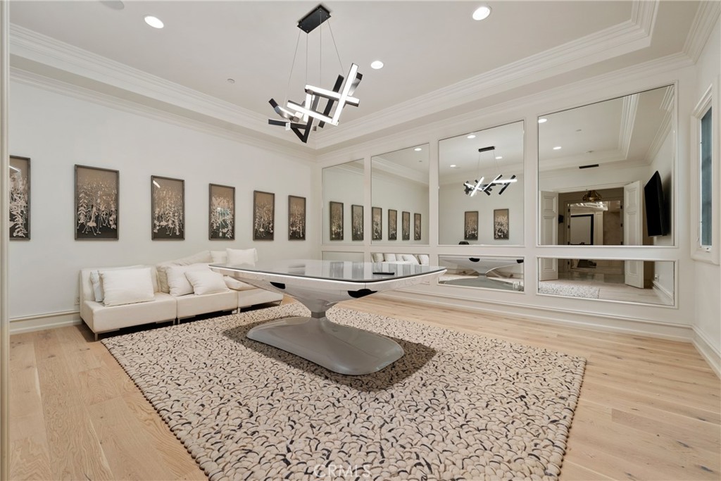 22 Deep Sea Newport Coast, CA 92657 - Photo 46 of 57 a living room with furniture and a chandelier