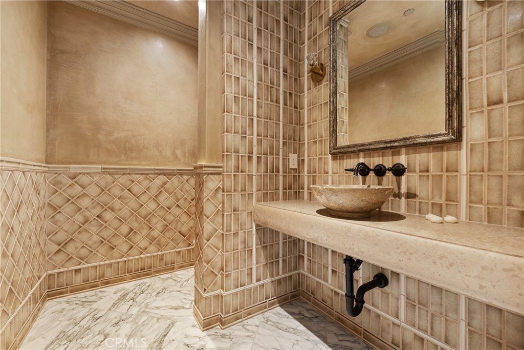 22 Deep Sea Newport Coast, CA 92657 - Photo 47 of 57 a bathroom with a sink and a mirror