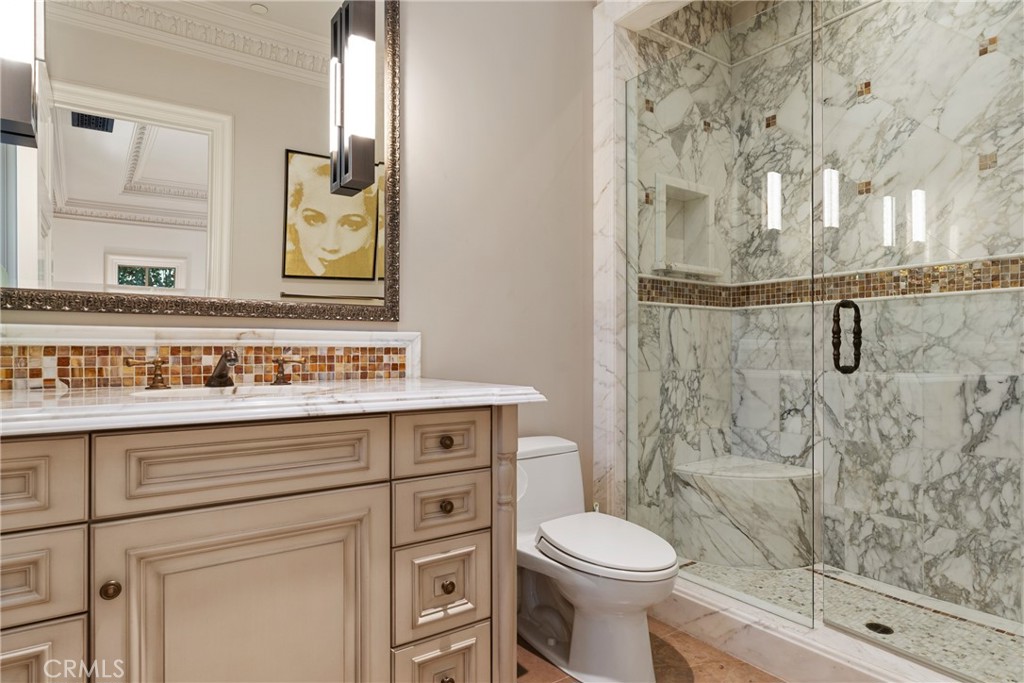 22 Deep Sea Newport Coast, CA 92657 - Photo 50 of 57 a bathroom with a granite countertop sink toilet and shower