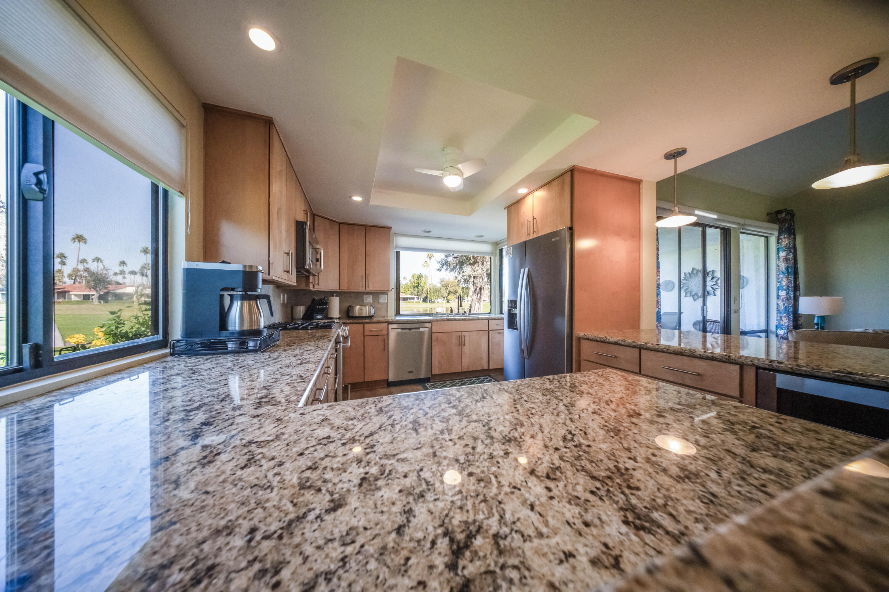 73 Marbella Drive Rancho Mirage, CA 92270 - Photo 13 of 43 a kitchen with stainless steel appliances granite countertop a refrigerator and stove