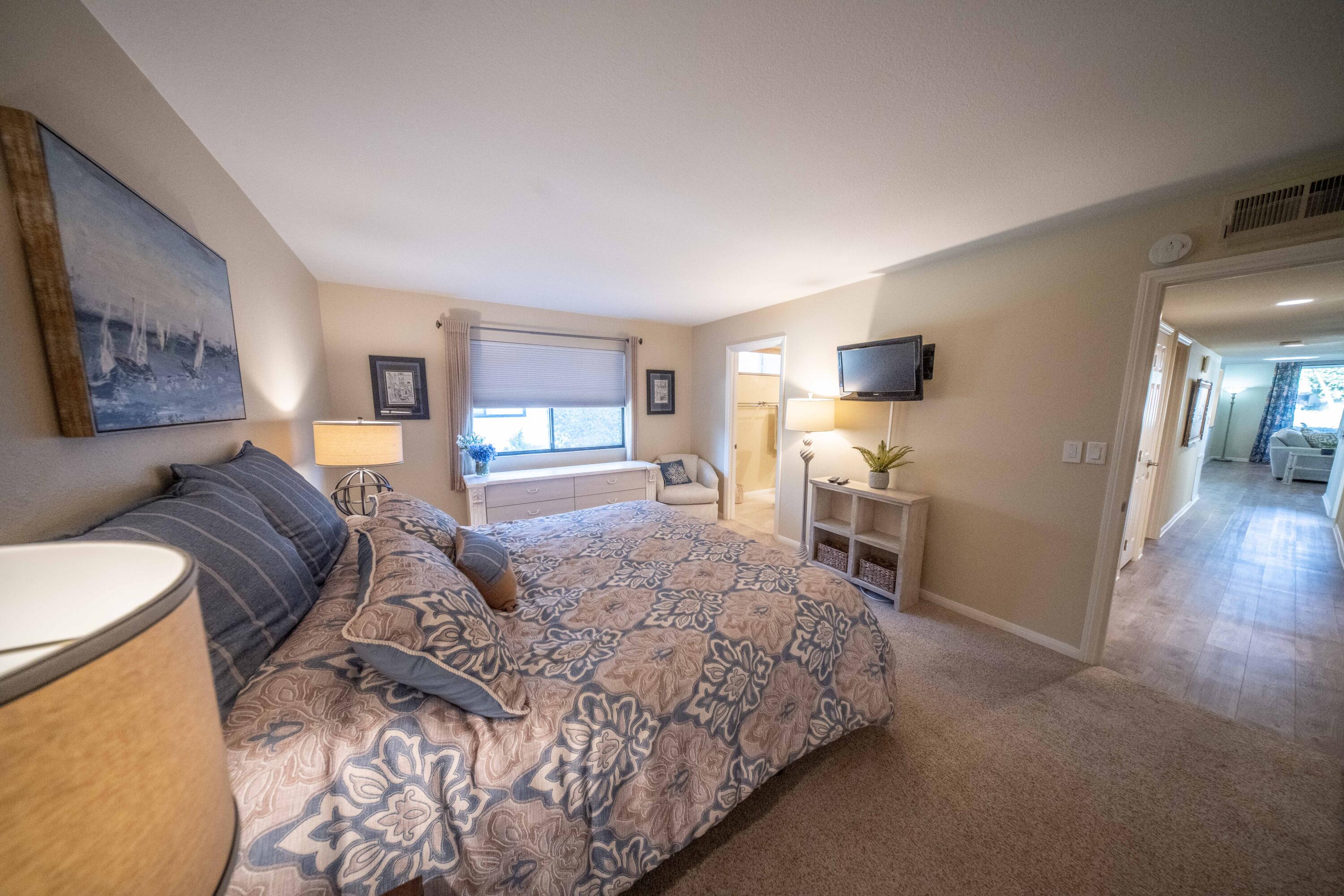 73 Marbella Drive Rancho Mirage, CA 92270 - Photo 16 of 43 a living room with a bed furniture and a flat screen tv