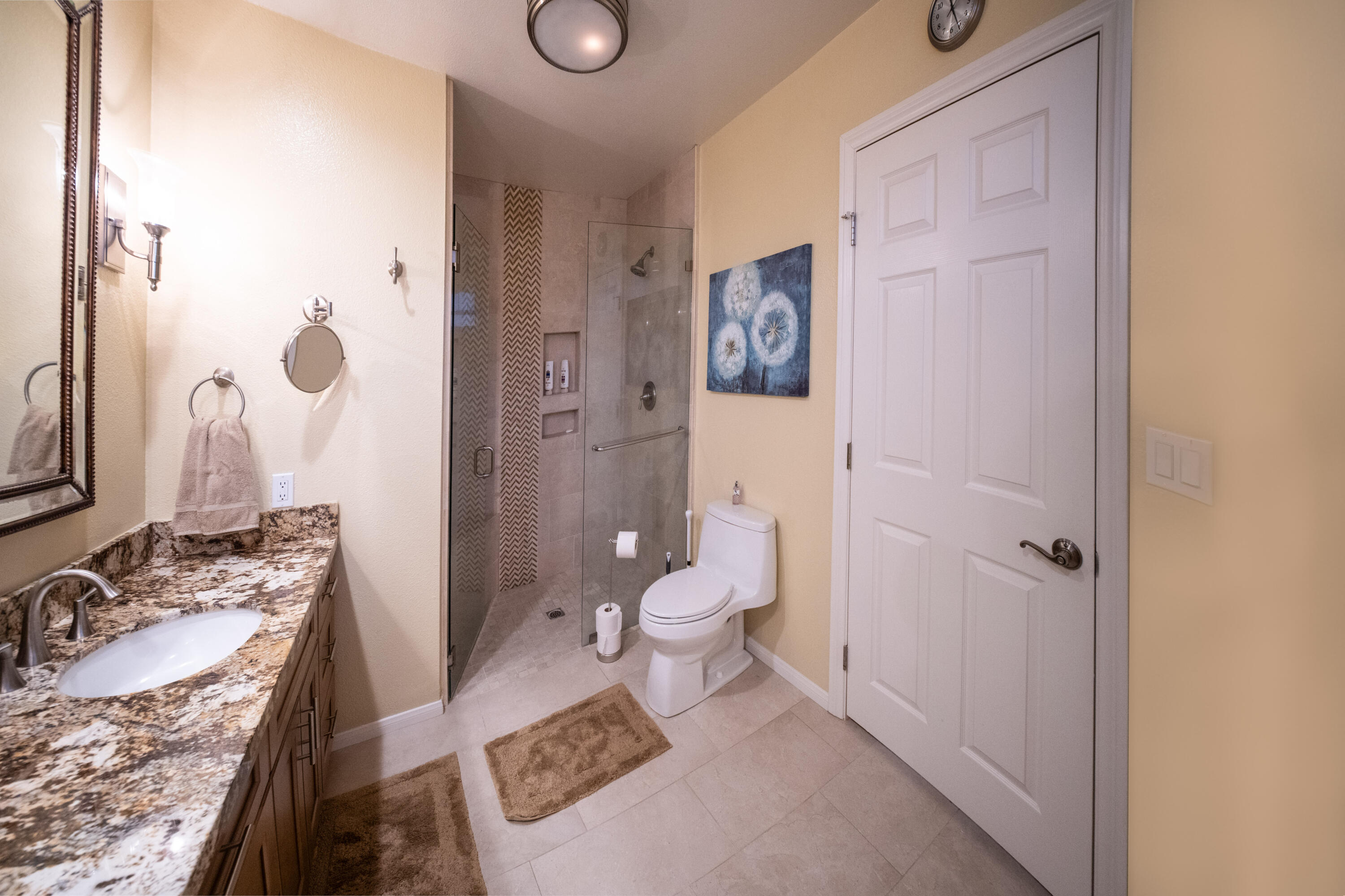 73 Marbella Drive Rancho Mirage, CA 92270 - Photo 18 of 43 a bathroom with a granite countertop sink toilet and shower