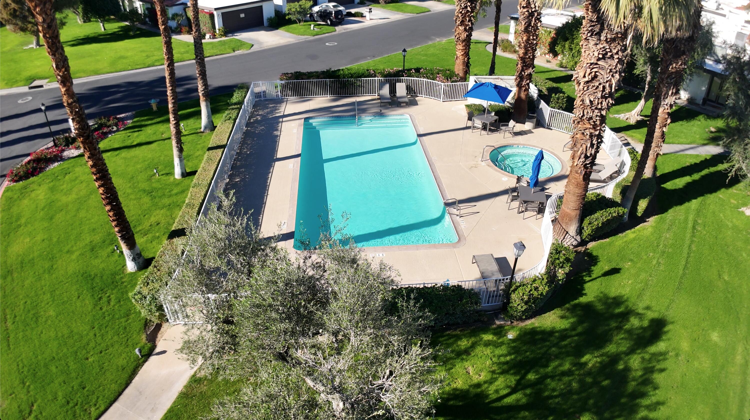 73 Marbella Drive Rancho Mirage, CA 92270 - Photo 28 of 43 an aerial view of a house with a yard and lake view