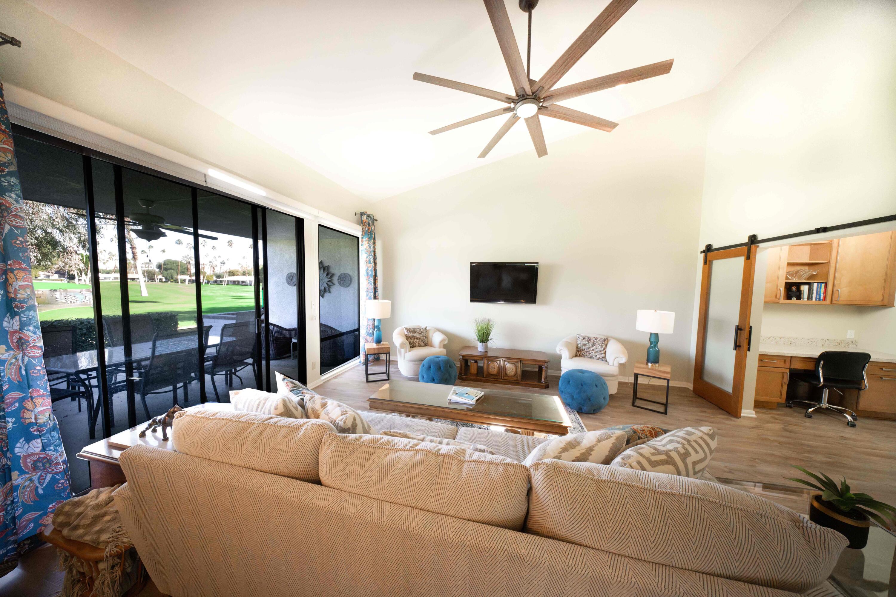 73 Marbella Drive Rancho Mirage, CA 92270 - Photo 10 of 43 a living room with furniture tv and a large window
