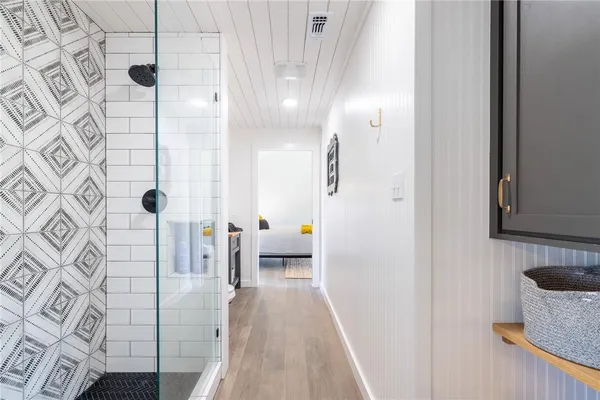 a white toilet sitting next to a bathroom sink