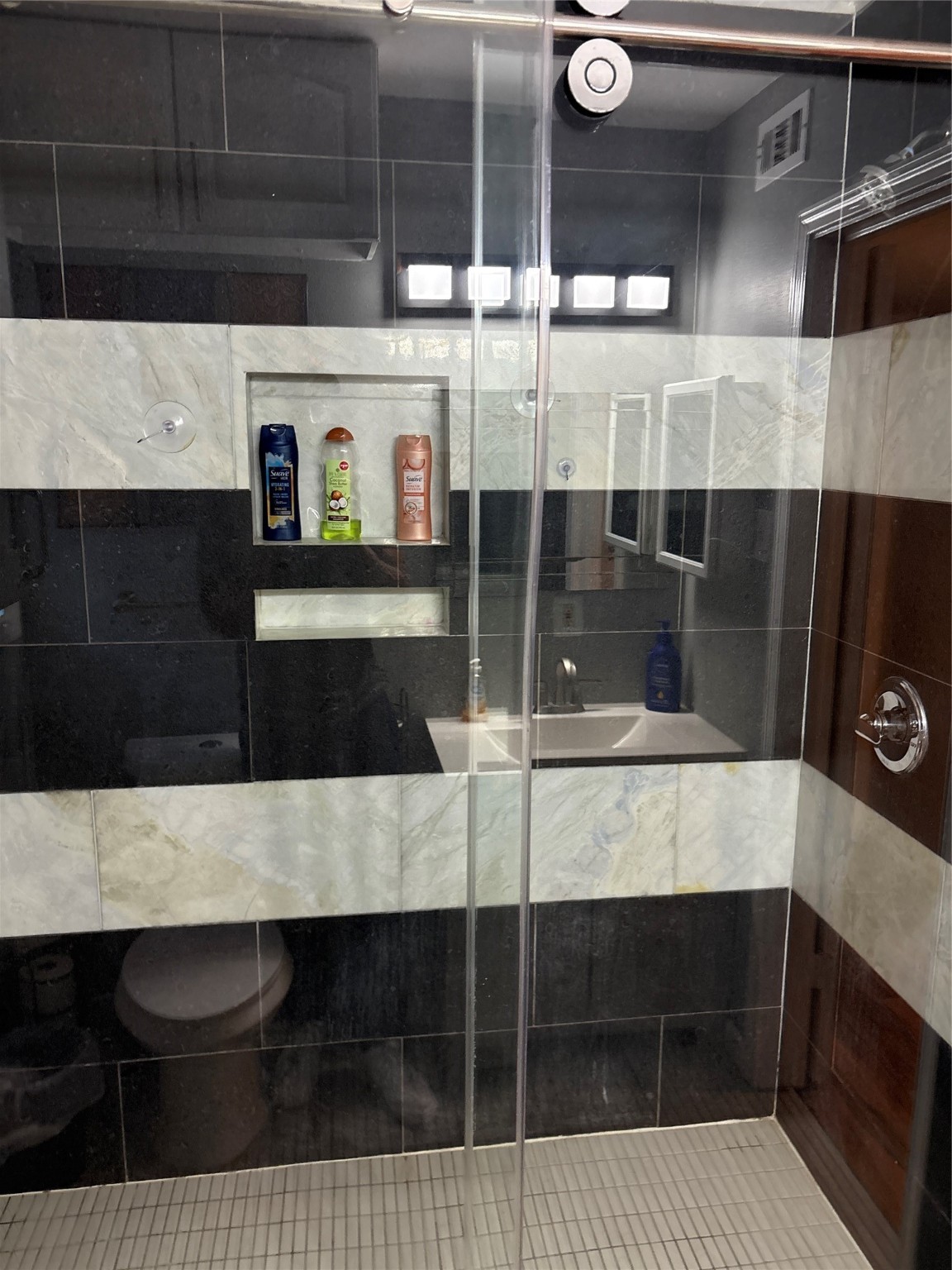 2201 Nettleton Street Houston, TX 77004 - Photo 11 of 21 a living room with stainless steel appliances kitchen island granite countertop a sink and a black cabinets