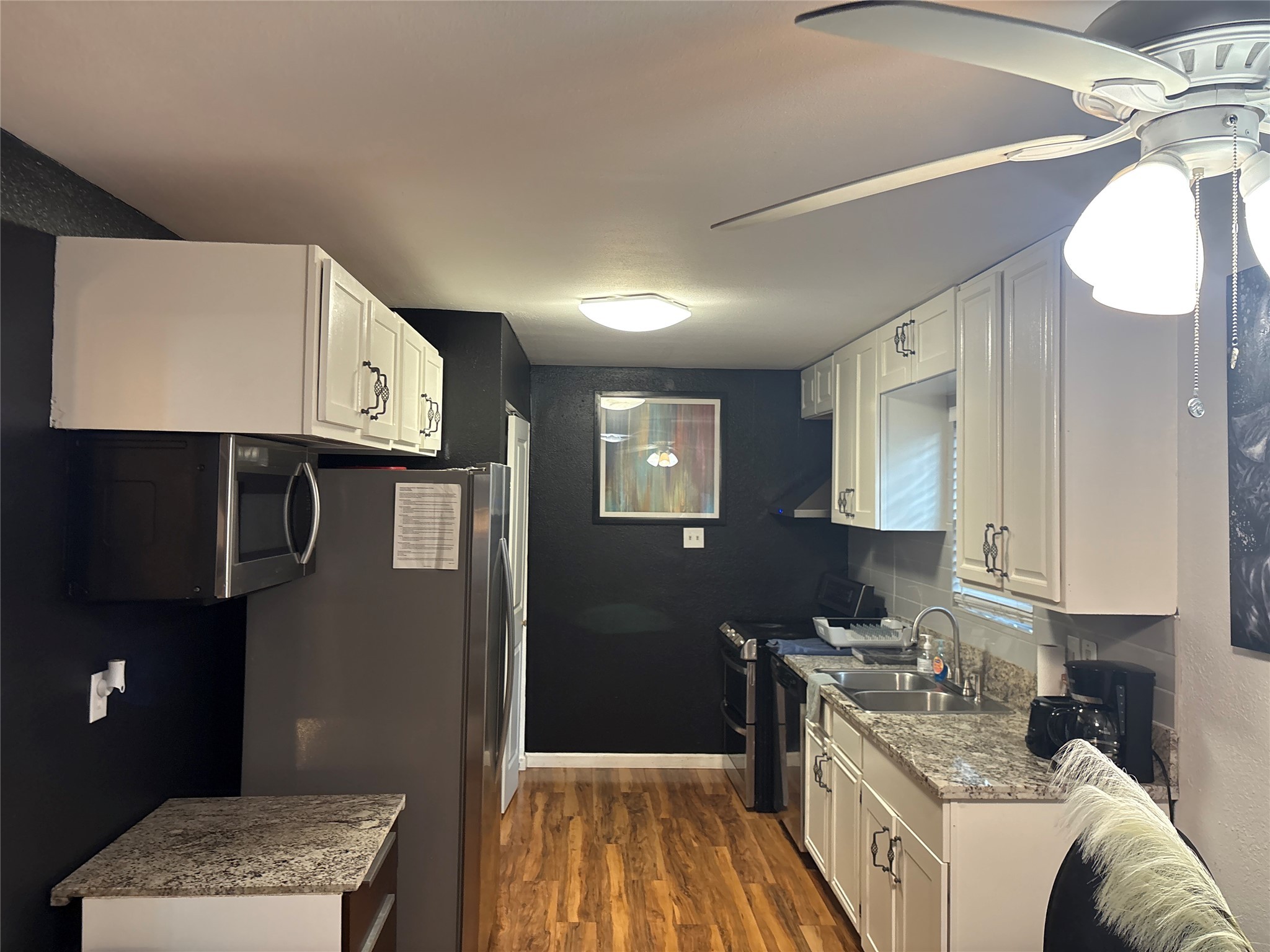 2201 Nettleton Street Houston, TX 77004 - Photo 14 of 21 a kitchen with stainless steel appliances granite countertop a sink stove and refrigerator