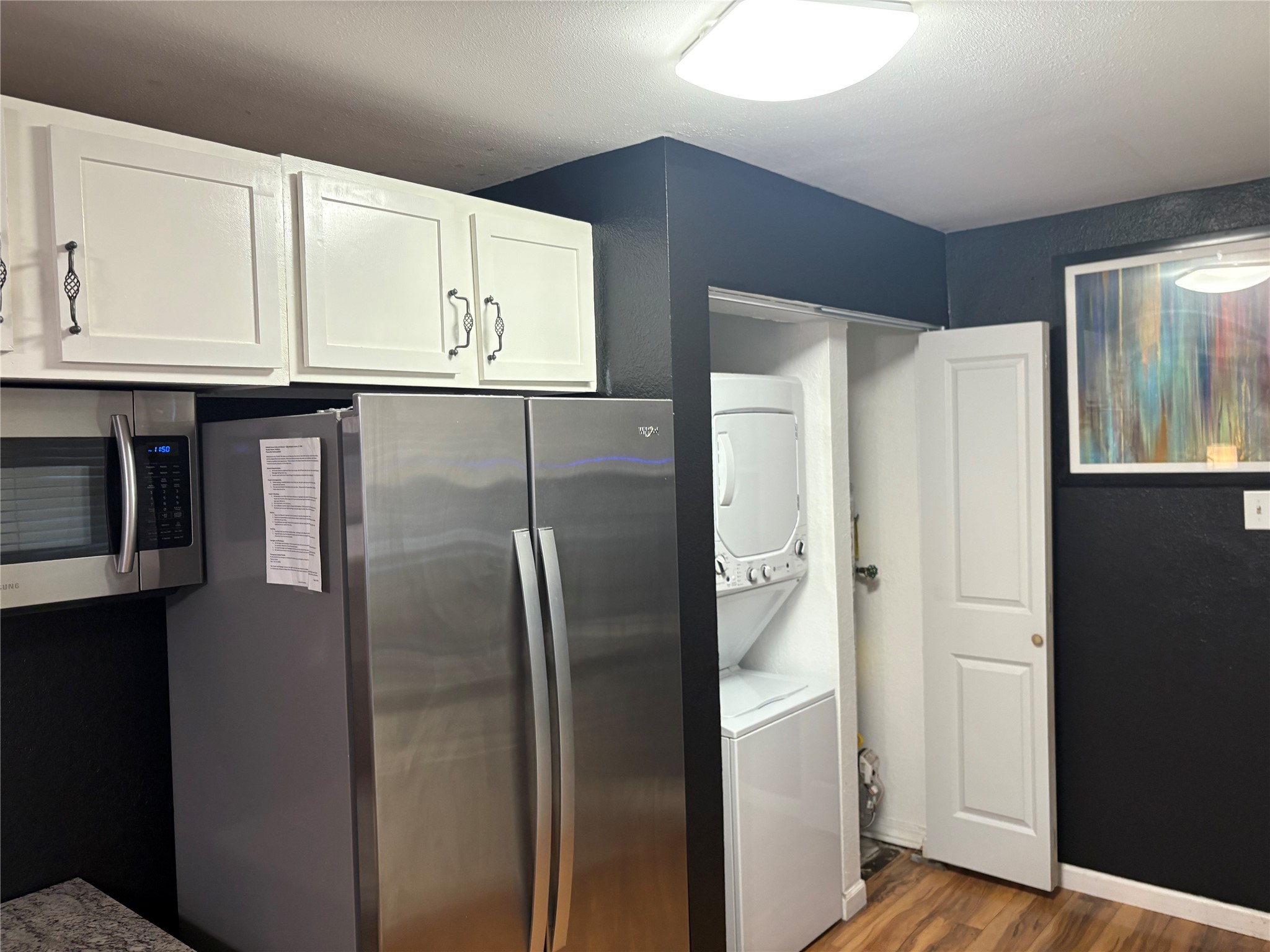 2201 Nettleton Street Houston, TX 77004 - Photo 17 of 21 a metallic refrigerator freezer sitting inside of a kitchen