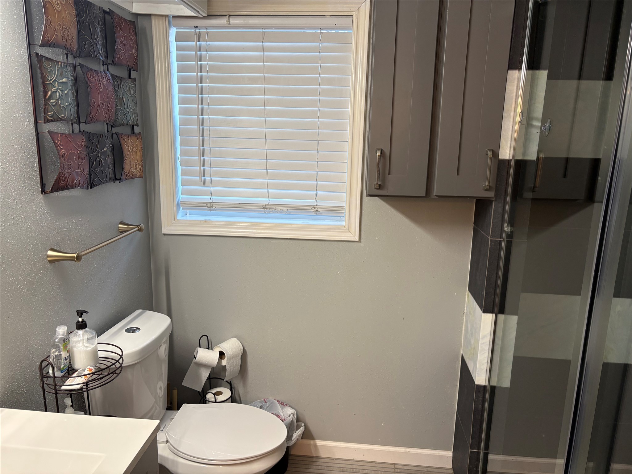 2201 Nettleton Street Houston, TX 77004 - Photo 18 of 21 a white toilet sitting next to a bathroom sink