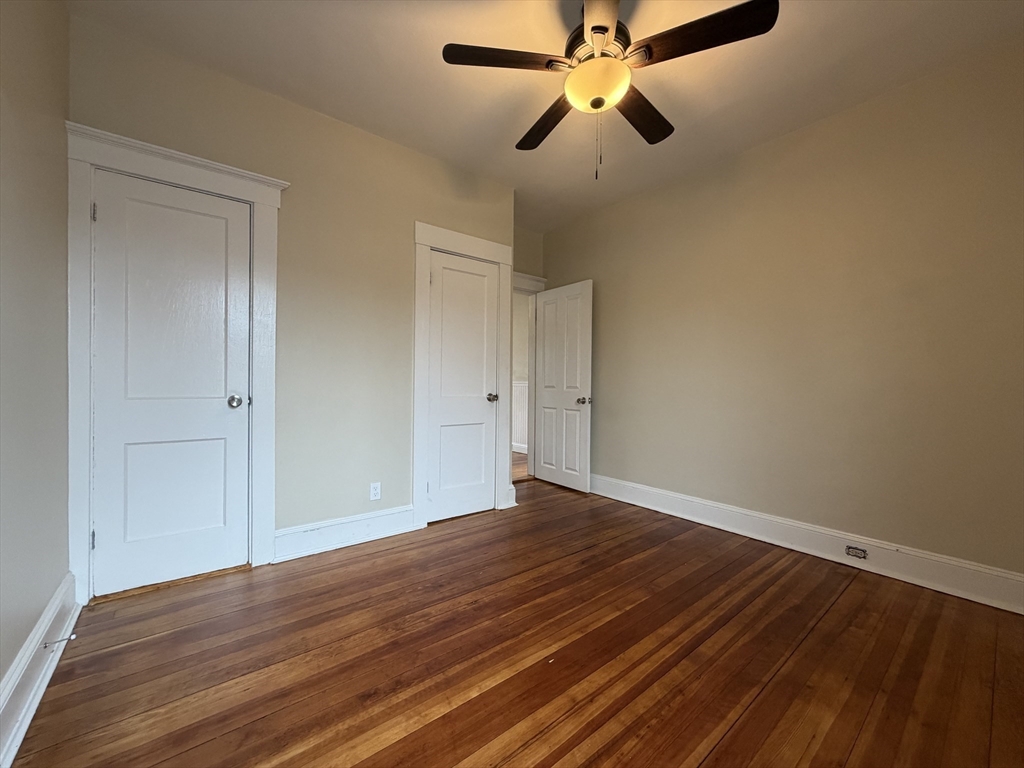 320 Wood Street, Unit 2 New Bedford, MA 02745 - Photo 12 of 23 a view of an empty room with wooden floor