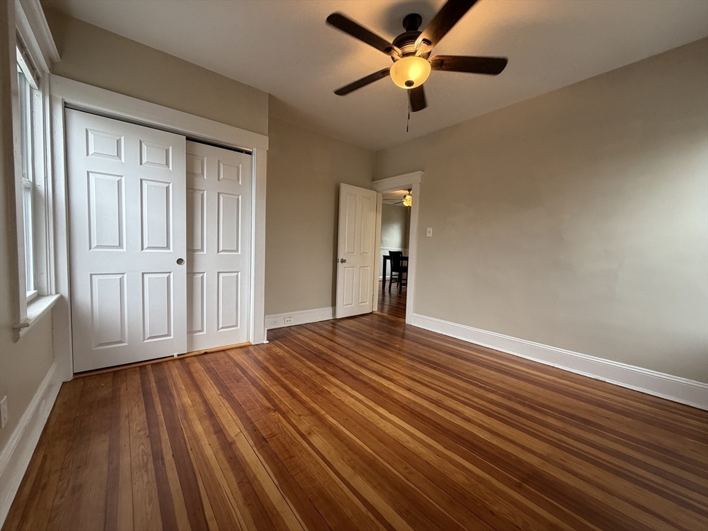 320 Wood Street, Unit 2 New Bedford, MA 02745 - Photo 14 of 23 wooden floor in an empty room with a window