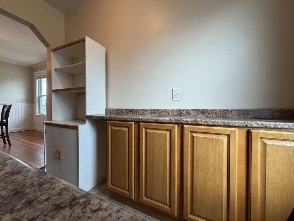 320 Wood Street, Unit 2 New Bedford, MA 02745 - Photo 20 of 23 a hallway with sliding door and natural light